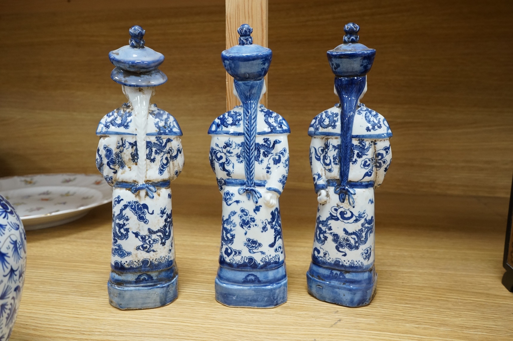 Three Chinese blue and white porcelain figures H 29cm x 9cm., and a Delft tobacco jar H 26cm W 18cm